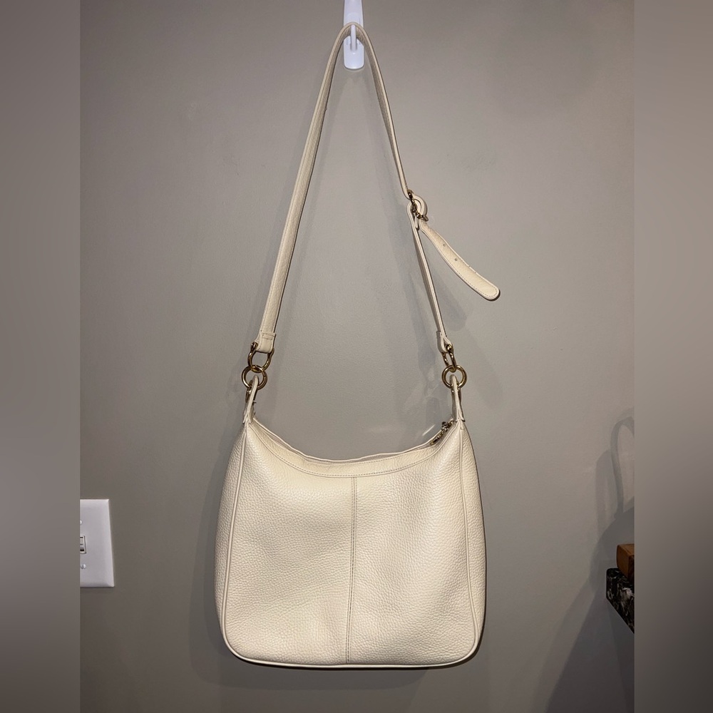 Medallion cream adjustable strap crossbody leather bag gold hardware